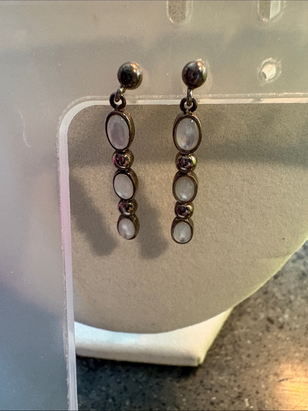 Delicate earrings, opals sat in silver